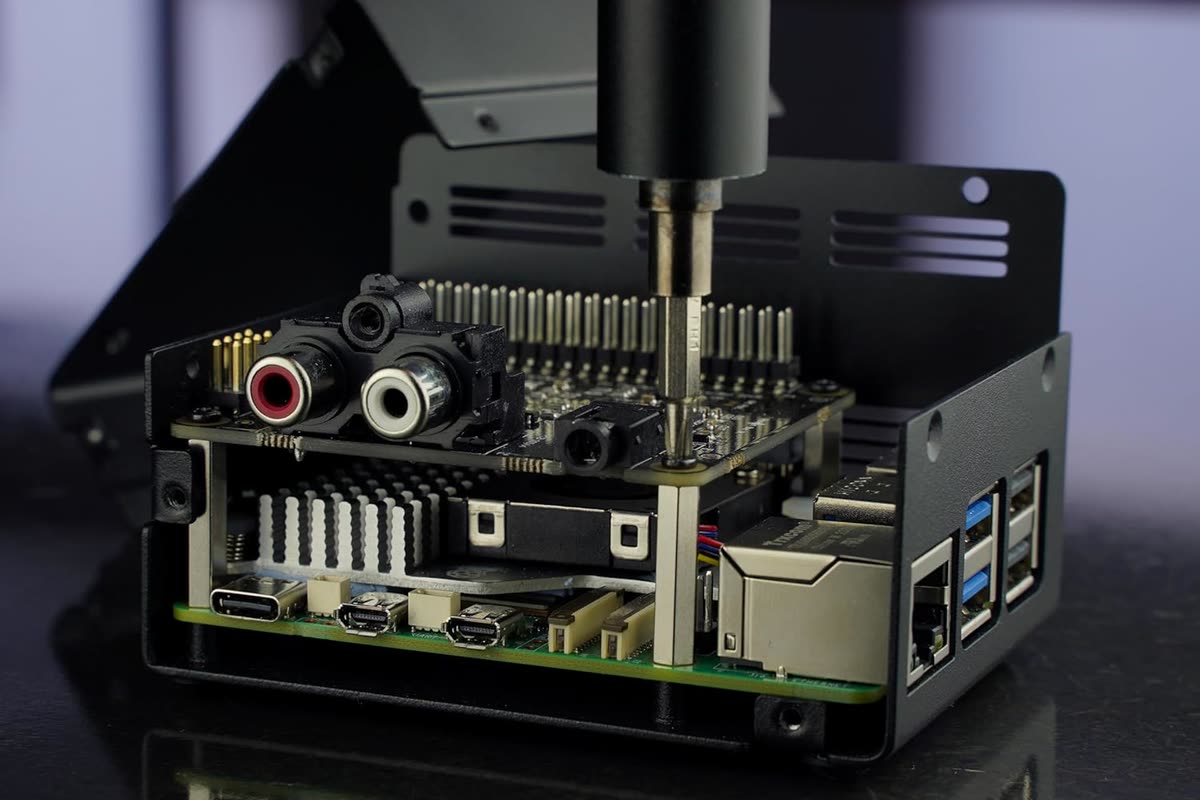 An open DrumPi case with the Pi and DAC board stacked inside