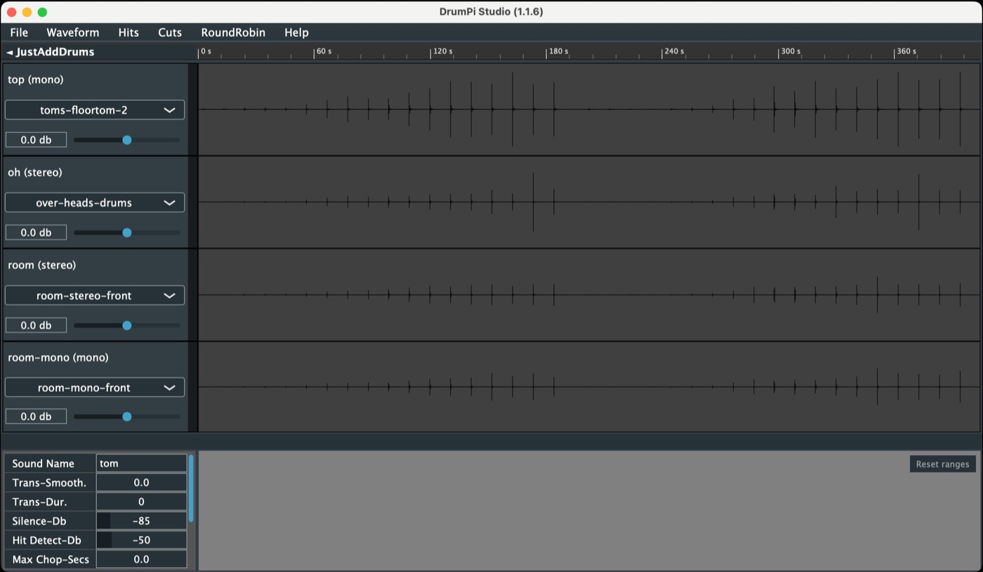 Four long microphone tracks loaded, every hit visible along the timeline